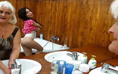 Hot Babe Seducing A Naughty Mature Lesbian In The Bathroom